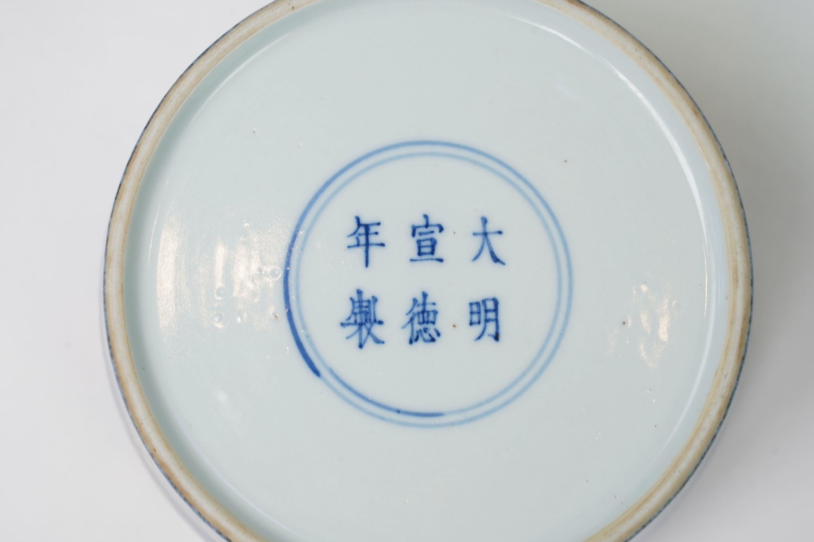 A Chinese gilt-decorated powder blue ‘fighting cricket’ box and cover, Xuande six character mark but later